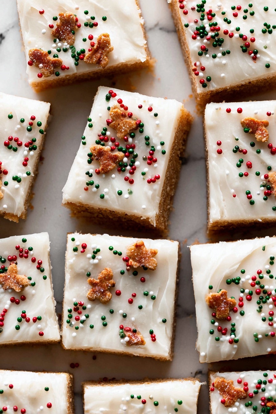 A close-up image of a square dessert bar with two visible layers placed on a black wire cooling rack on a white marbled surface. The bottom layer is dense and dark brown with a moist texture, while the top layer is thick, creamy, and white, slightly thicker than the bottom layer. The white layer is decorated with small round red, green, and white sprinkles along with small brown sprinkles shaped like gingerbread men, scattered across evenly. The focus is on the front dessert bar with a bite taken out from the corner, showing the layered texture clearly. Other similar bars are blurred in the background. Photo taken with an iphone --ar 2:3 --v 7