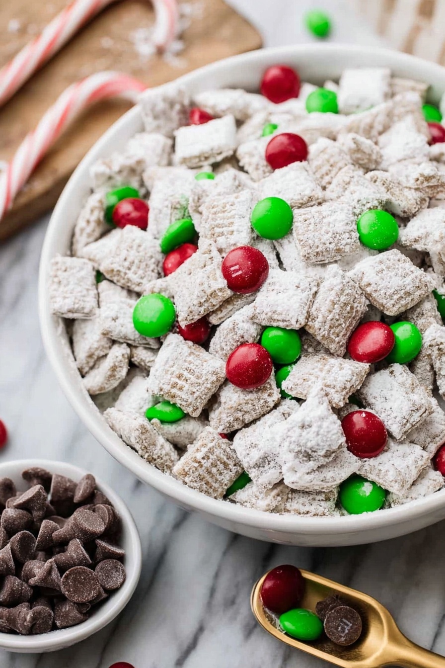 A large white bowl is filled with many small square cereal pieces coated in white powder, making the texture look soft and snowy. Scattered on and around these cereal pieces are shiny red and green round candies with a glossy, smooth surface. Next to the bowl is a smaller white bowl also filled with the same red and green round candies. A small light wooden scoop holds some candies in the bottom right corner. The setup sits on a brown wooden table with visible grain, next to a green cloth with white polka dots that is wrinkled and folded. A few candies are scattered loosely on the table around the bowls photo taken with an iphone --ar 2:3 --v 7